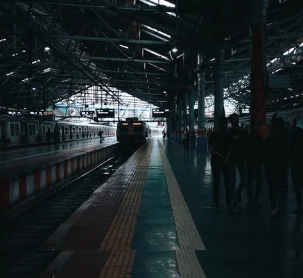 Mumbai local train at railway station platform - passengers waiting
